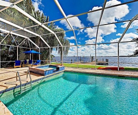 Riverfront Paradise with Caged Pool, Hot Tub & Dock home